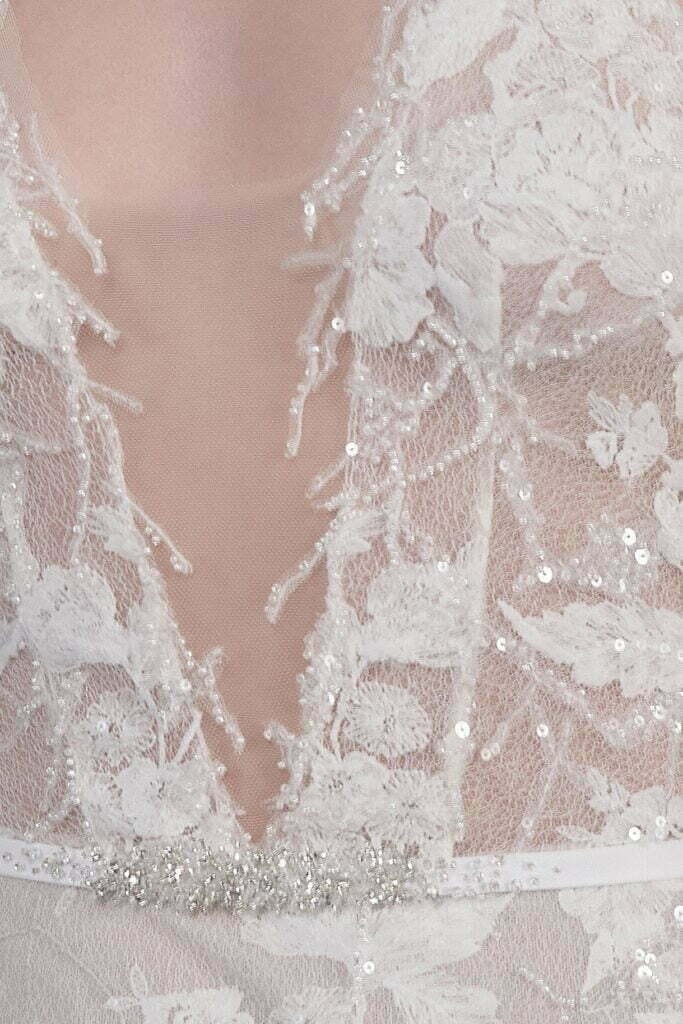 White lace dress with sequins and beading.