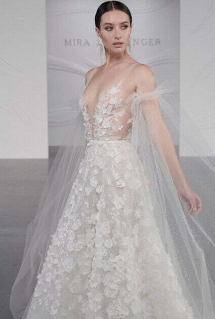 ruffled drop- tulle sleeves.