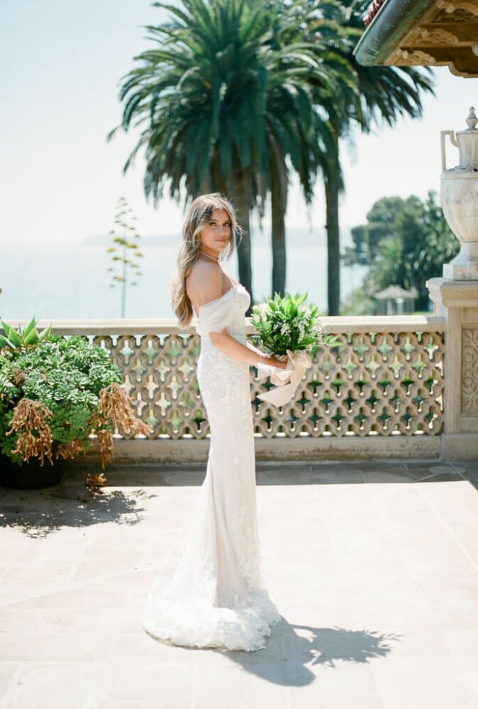 Mira bride wearing Chaz gown, draped sleeves & veil