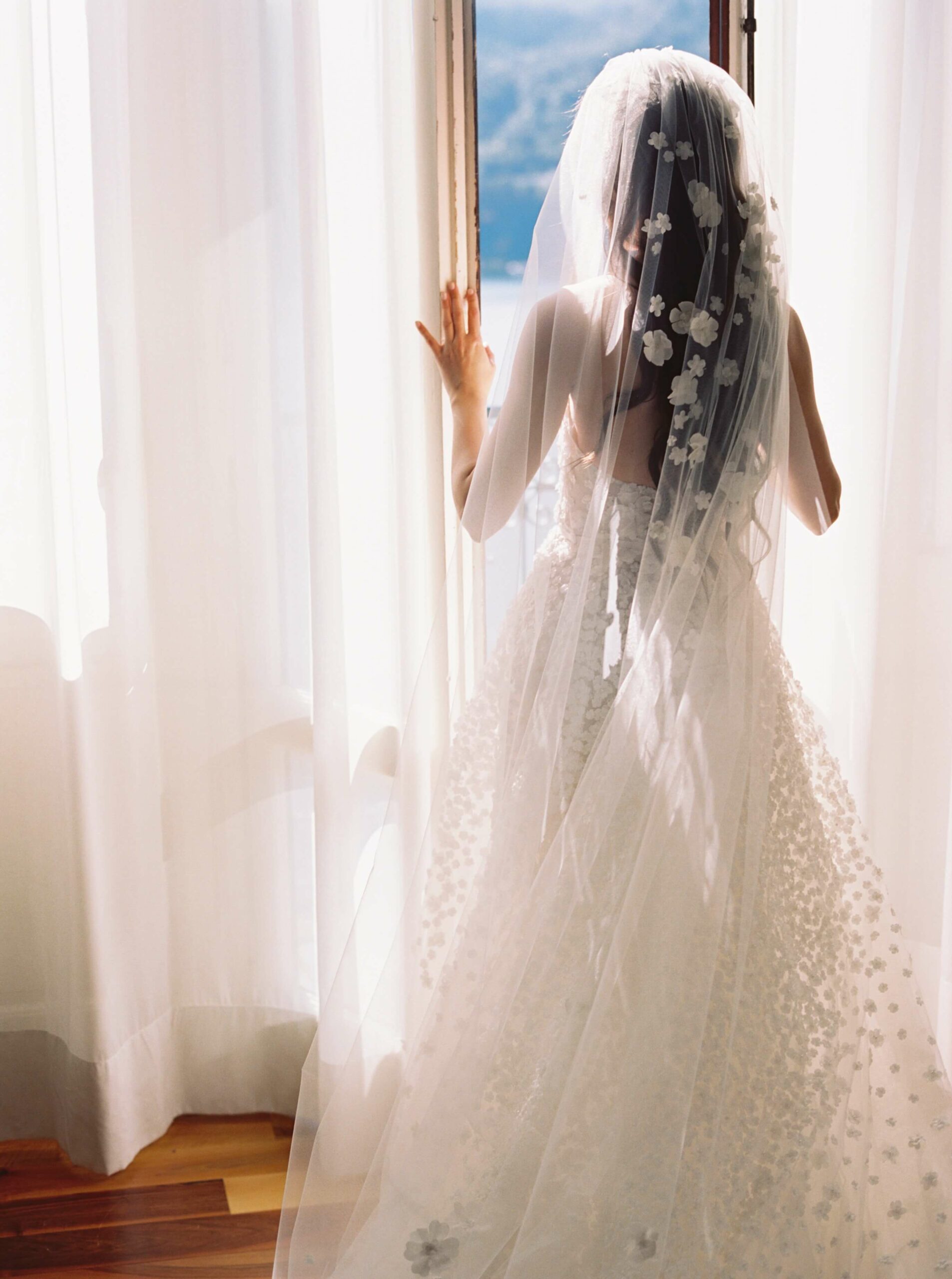 Anasasia wearing Gigi gown, cuffs & veil