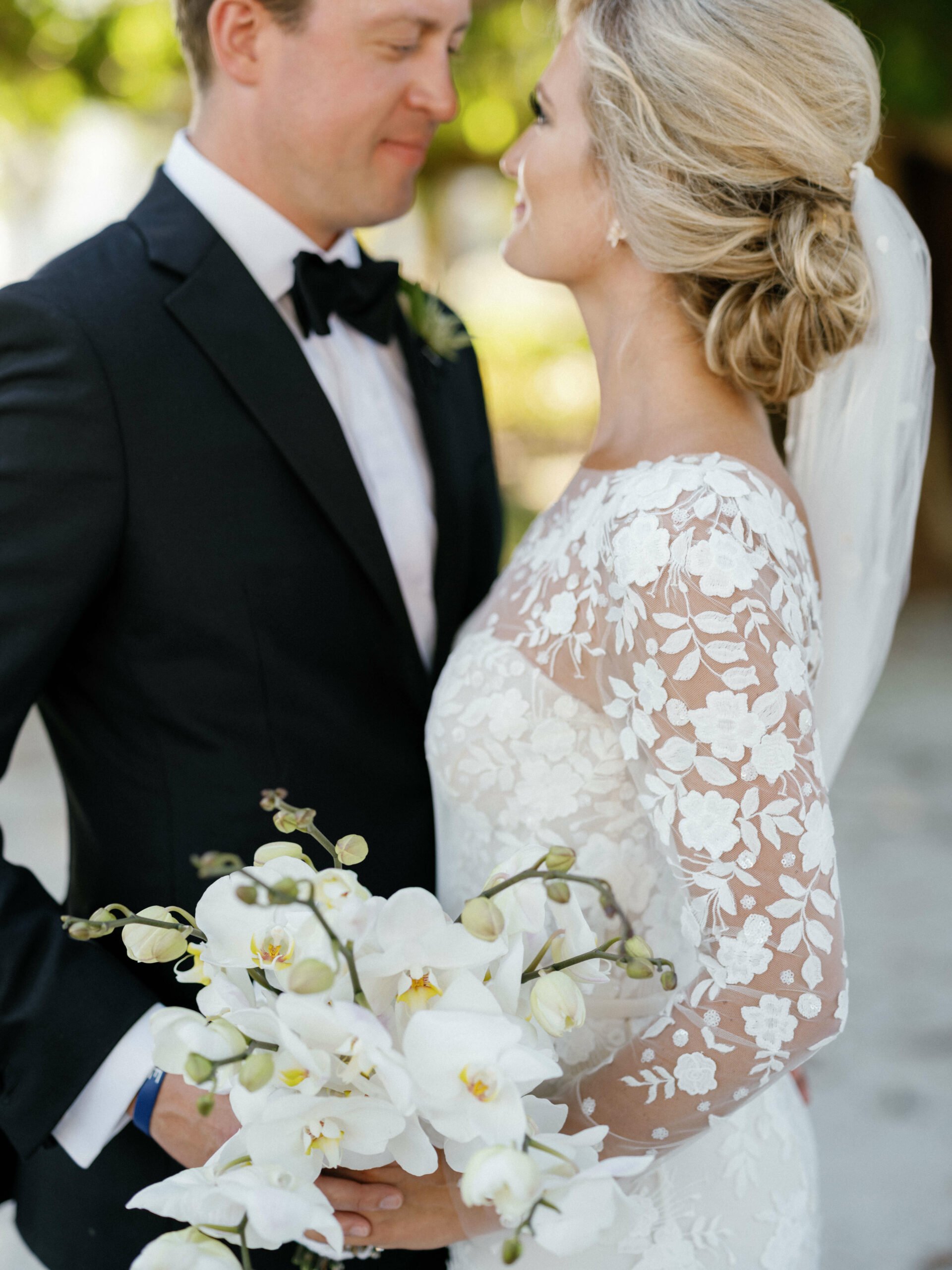 Kristen wearing custom strapless Verona gown, topper & veil