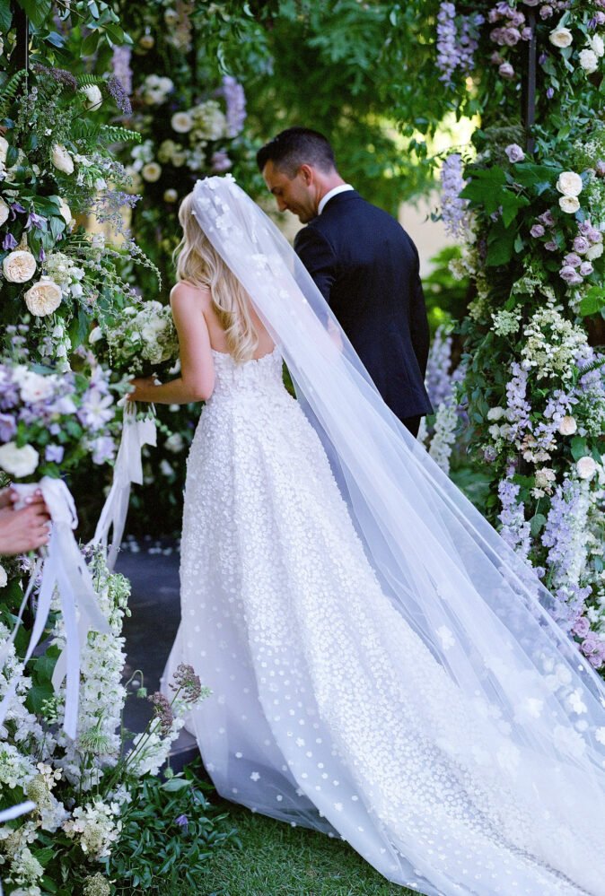 Kristen Burns wearing Gigi & Matching veil