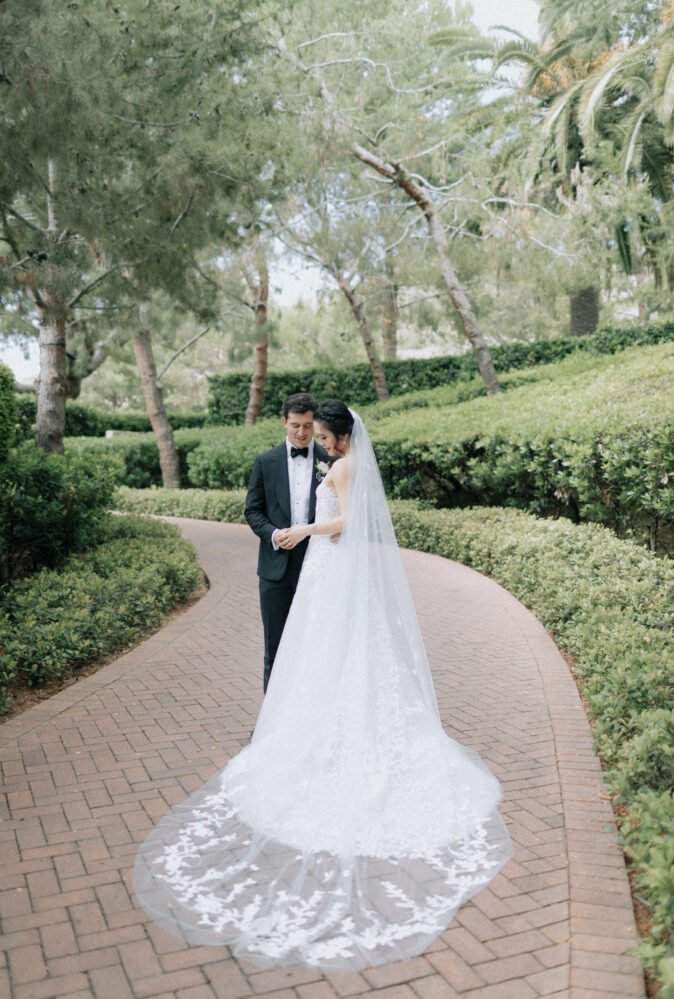 Laura Chen wearing Charla & matching veil