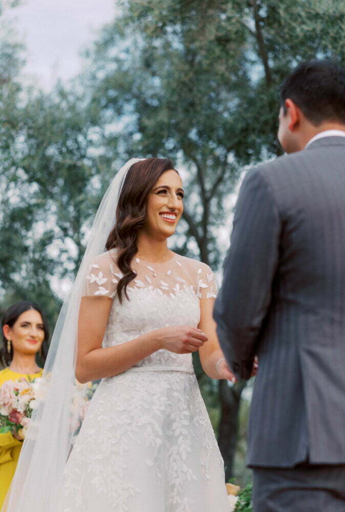 Mahsaw Motlagh wearing Charla gown, matching topper & matching veil