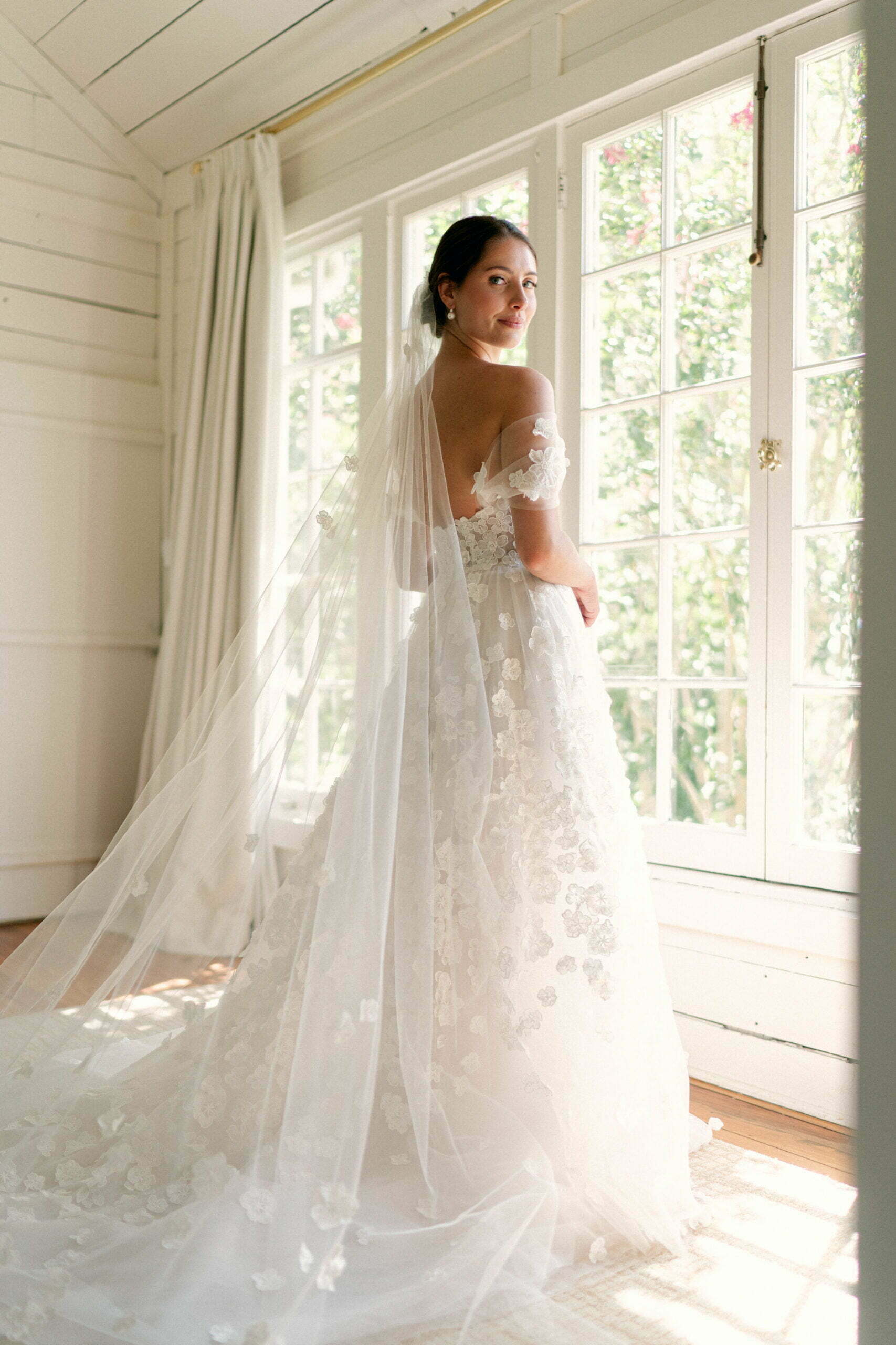 Fiona Parcharidis wearing custom Limka gown with cuffs & matching veil