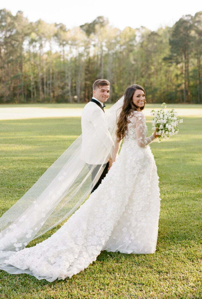 Savannah Paletta wearing Suri gown & Suri topper & veil