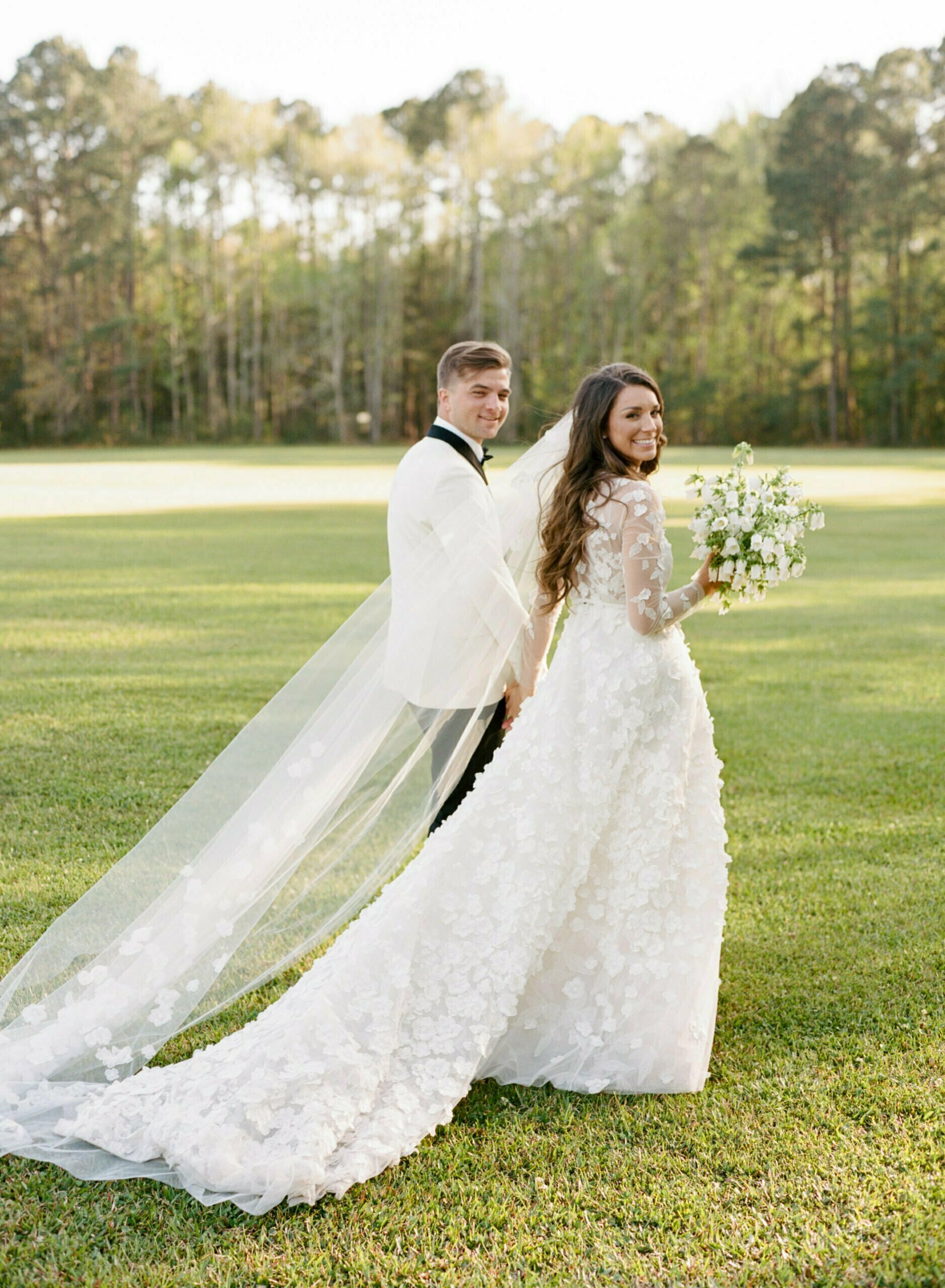 Savannah Paletta wearing Suri gown & Suri topper & veil