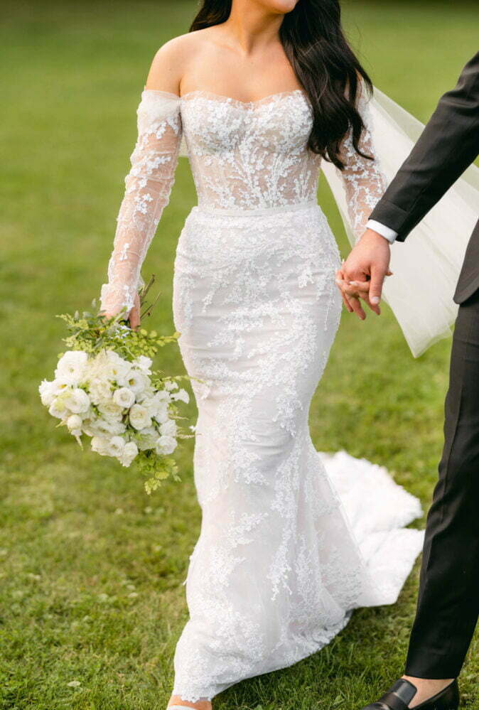 Brooke Mclay wearing Jess gown with matchig cuffs and sleeves