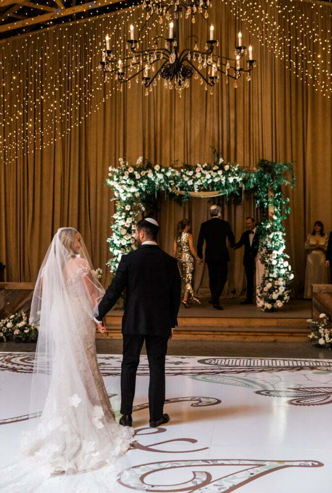 Niki Dickman wearing Brunella gown, veil & topper