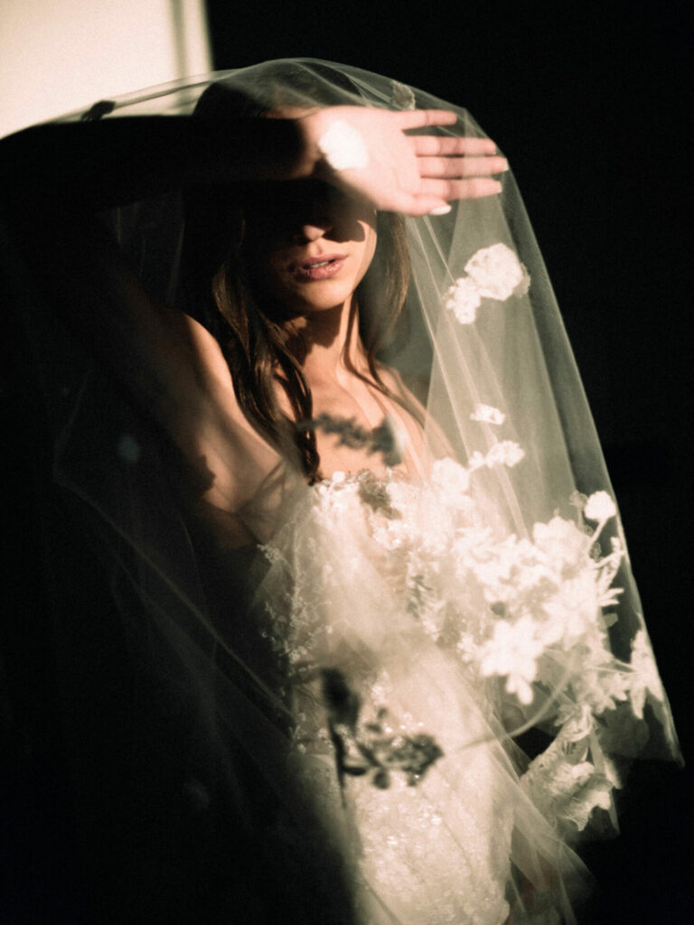 Isabelle Bernstein wearing Jess gown, matching shrug & veil