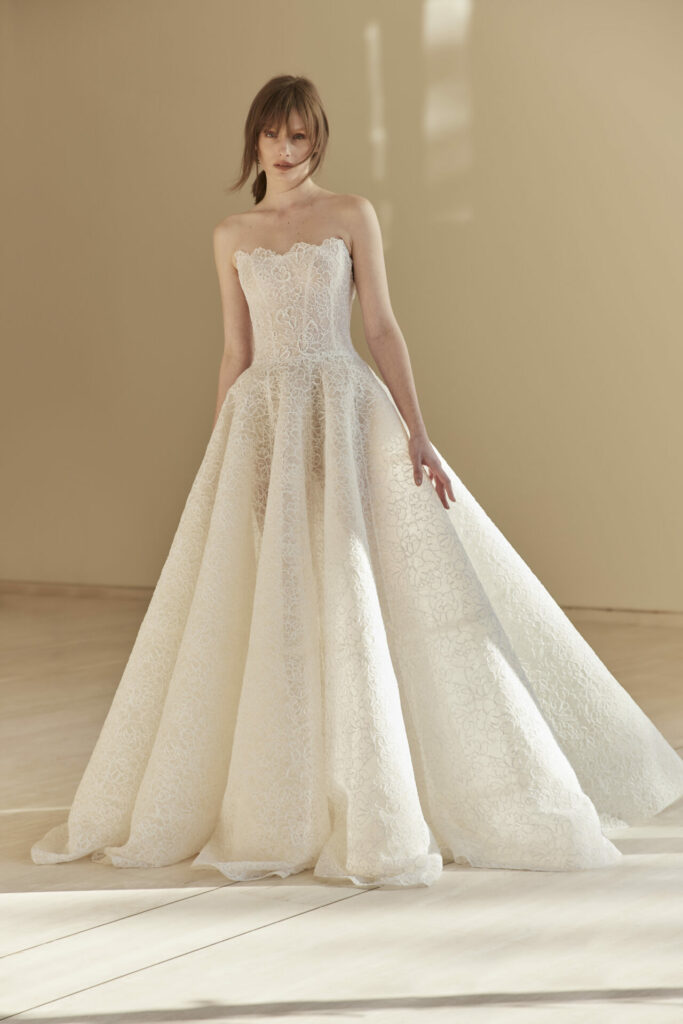 Woman in strapless lace ball gown dress.