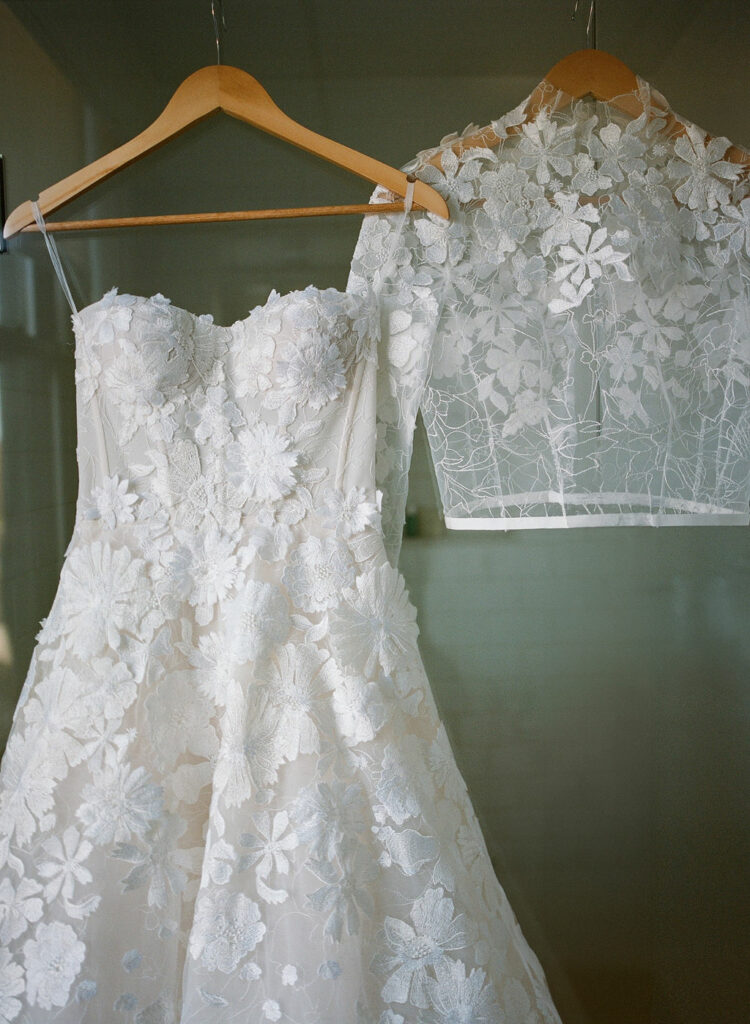 White strapless lace wedding dress and jacket.