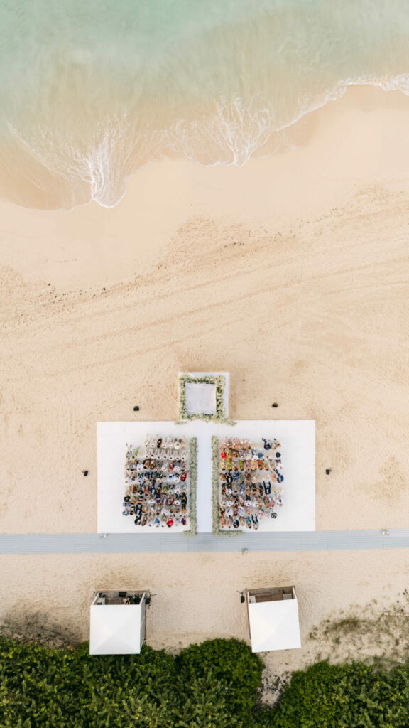 Beach wedding with guests and bride Katya Ruiz.