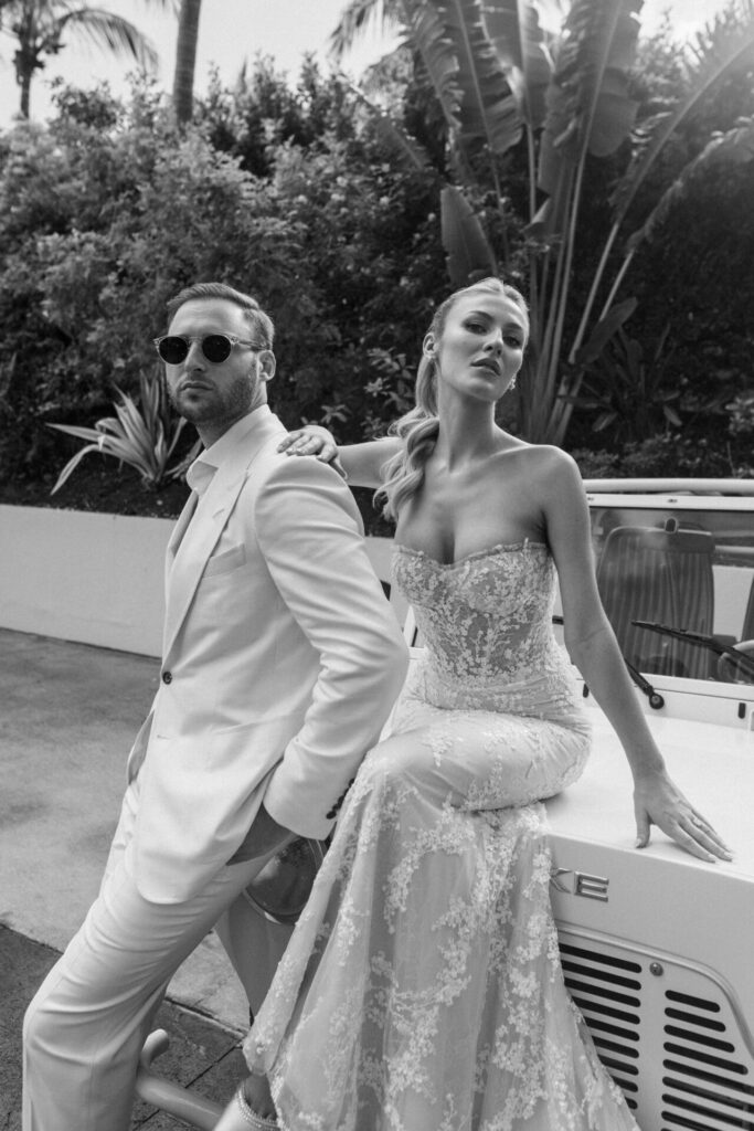 Stylish couple with bride in couture gown.