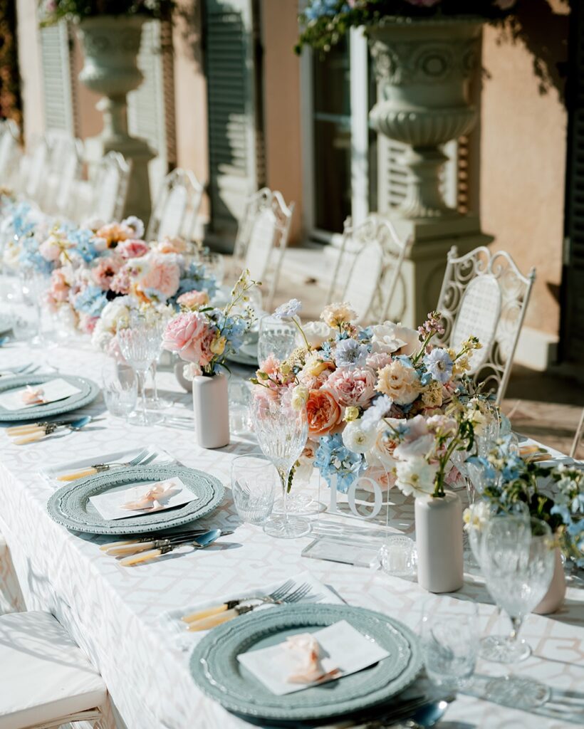 Elegant outdoor table with florals and crystal.