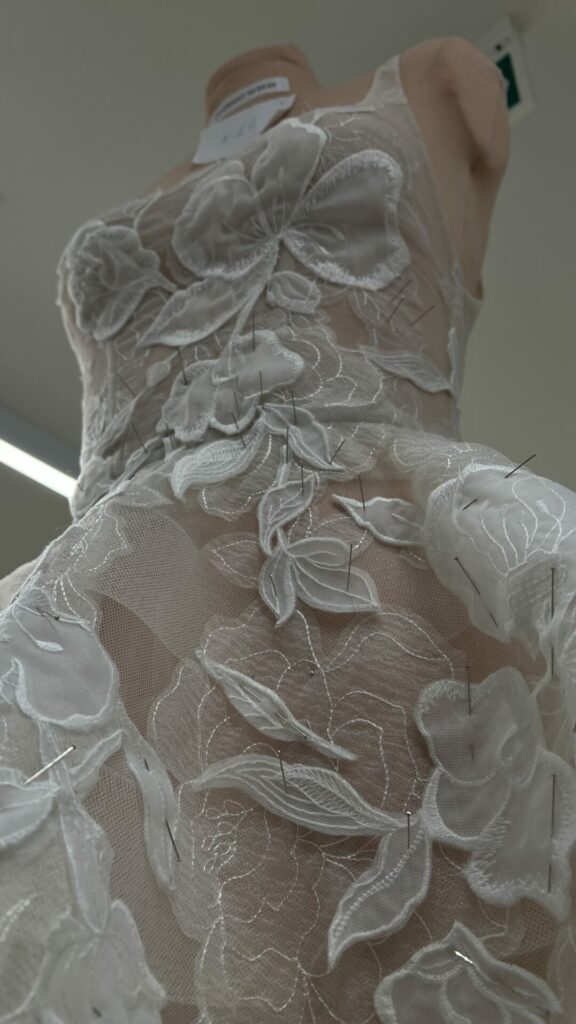 Mannequin with sheer fabric and 3D florals.