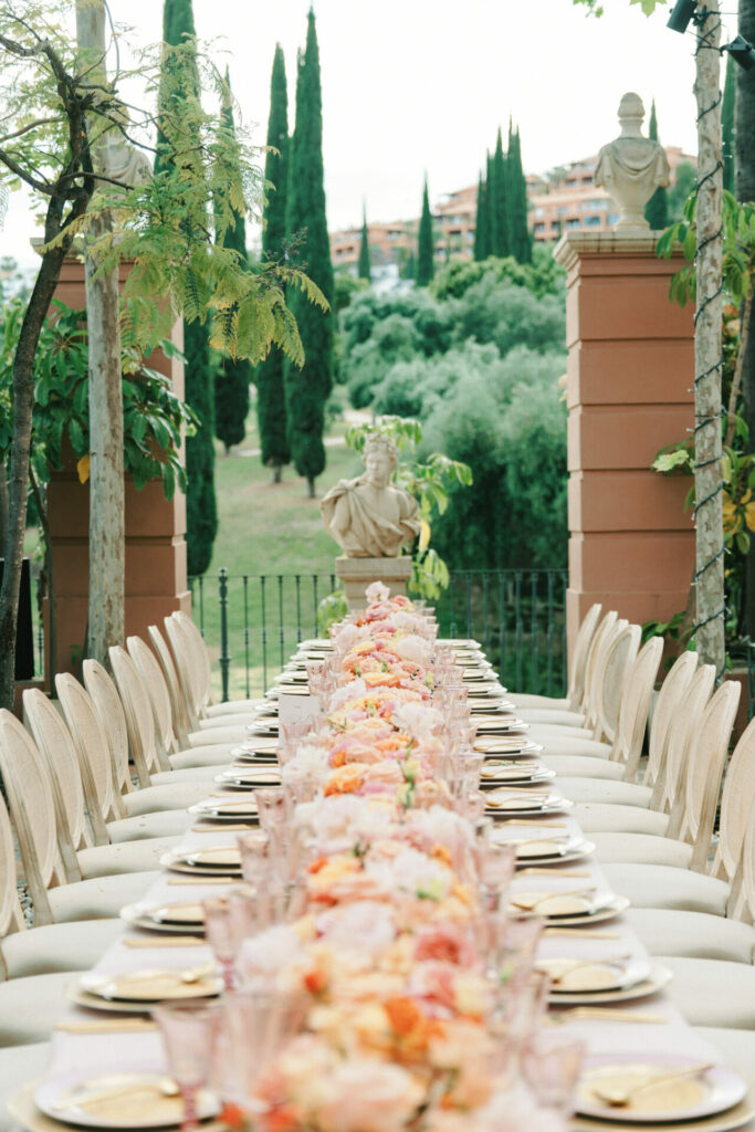 Elegant outdoor table, floral decor, luxe garden celebration.