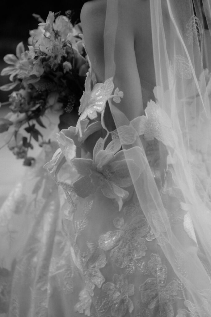 Katya Ruiz in floral Mira Zwillinger gown.