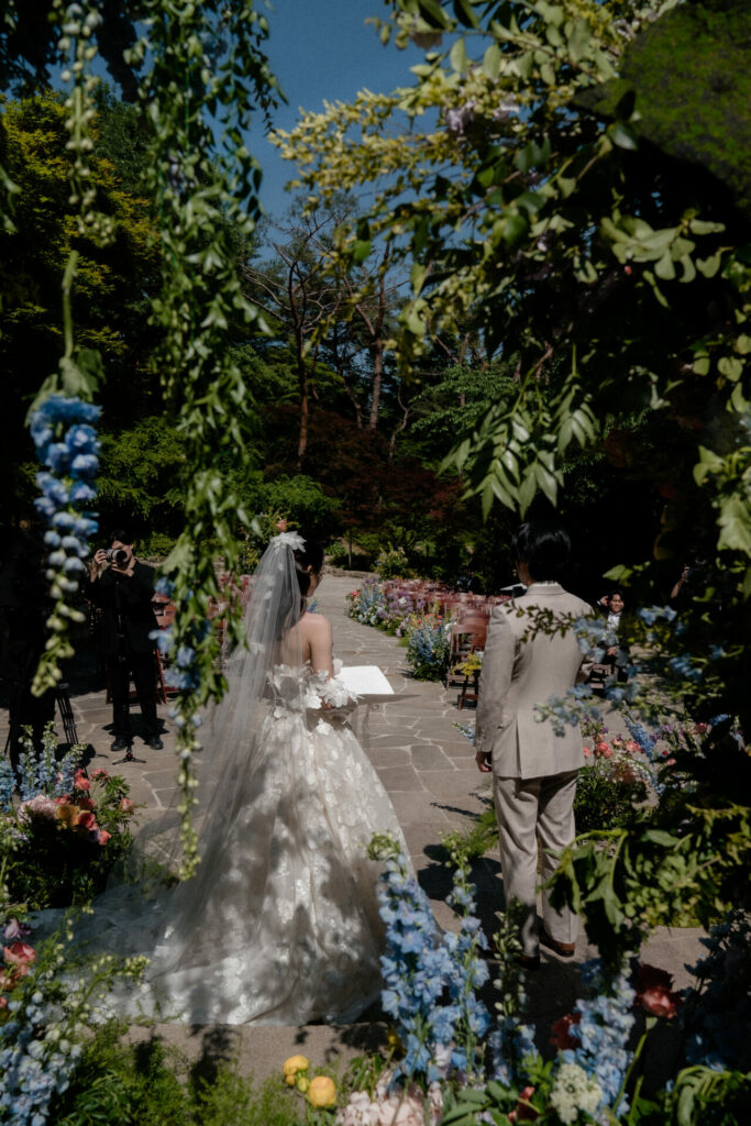 Bride Katya Ruiz outdoors in Mira Zwillinger gown.