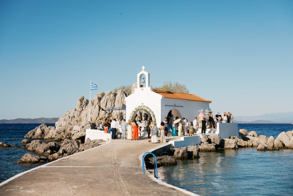 Bride Katya Ruiz arrives at seaside chapel celebration.