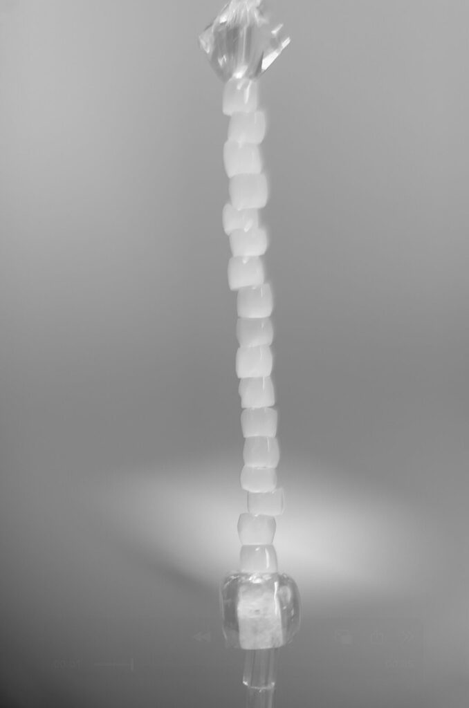 Stacked beads on rod, modern bridal jewelry.