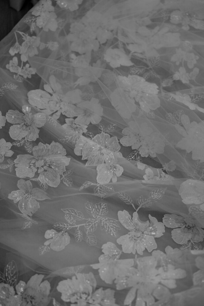 Sheer, monochrome floral fabric inspired by luxury bridal couture.