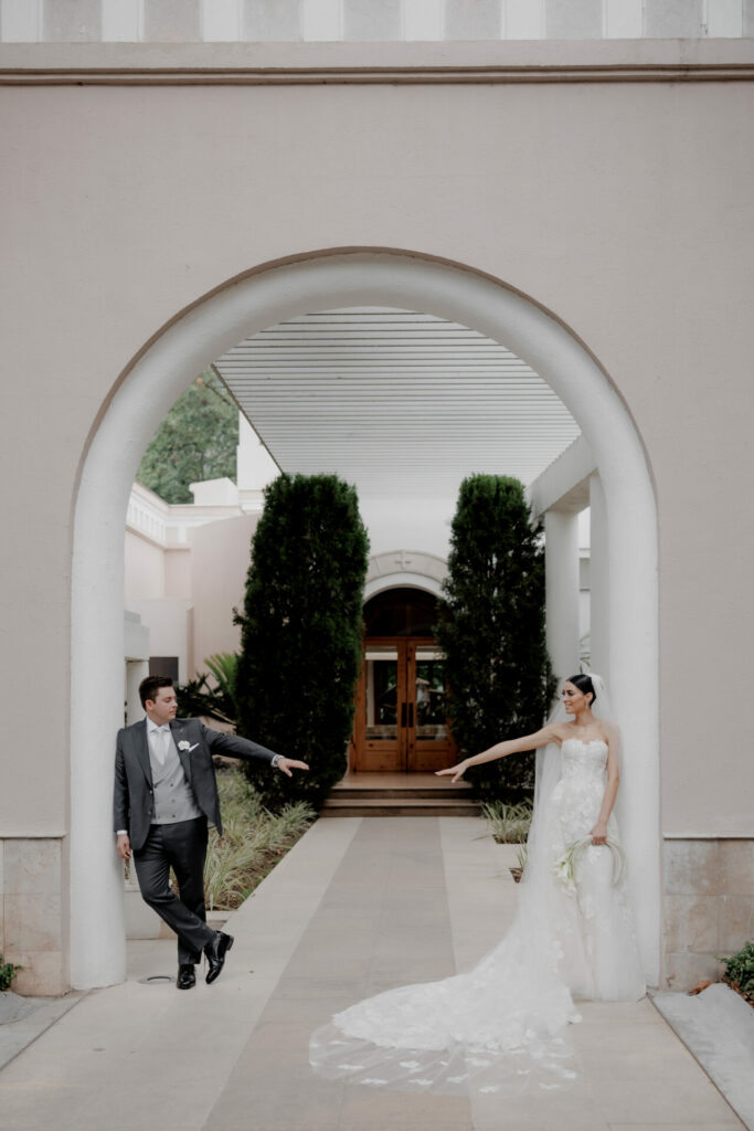 Elegant bride Katya Ruiz in couture gown with suited man.