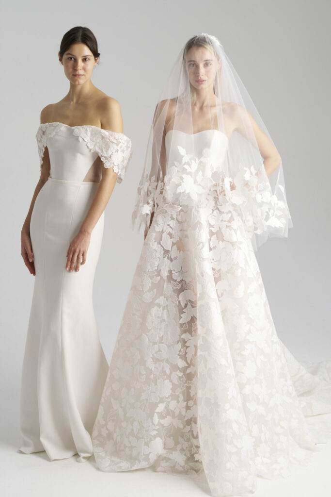 Two women in stylish Ness & Nessia bridal gowns.