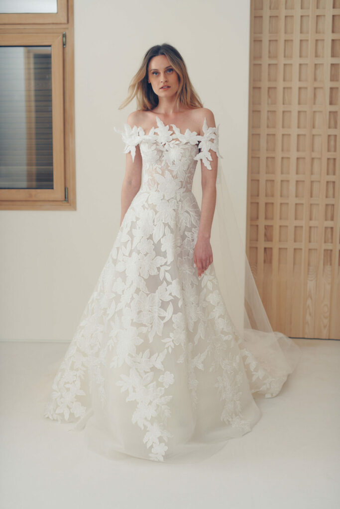 Woman in white dress modeling our new veils.