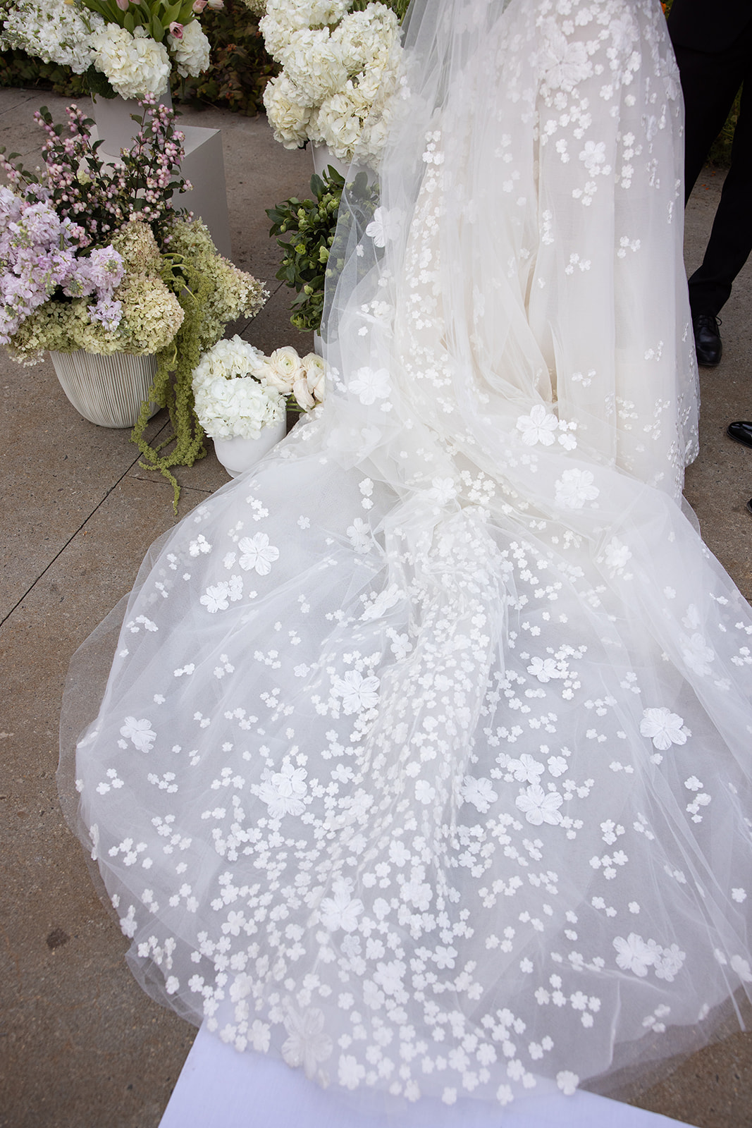 White wedding dress with 3D floral train, flowers.