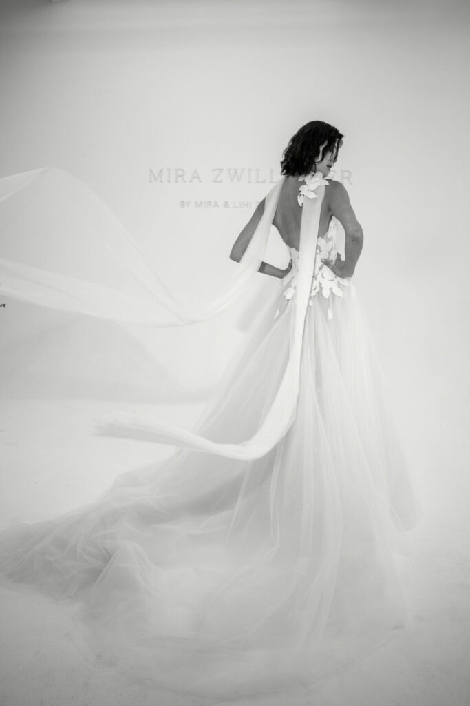 Bride in floral gown, long veil, minimalist studio, Mira Zwillinger backdrop.