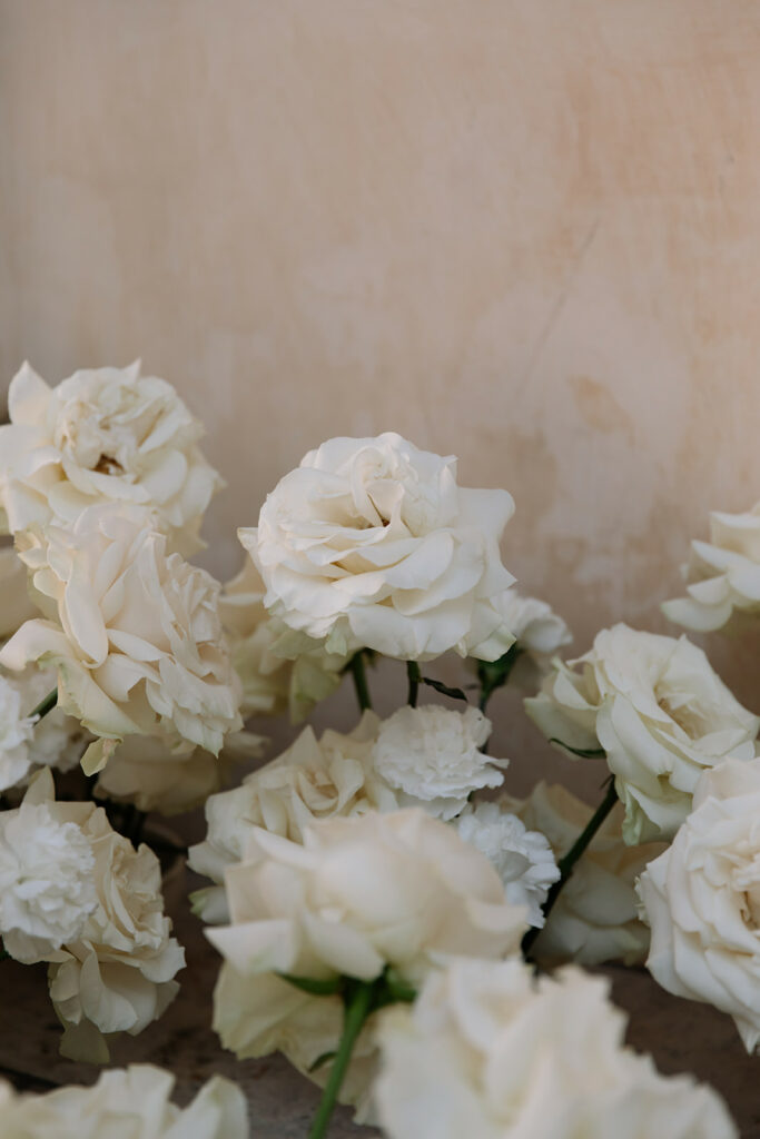 White roses evoke elegant, couture bridal style.