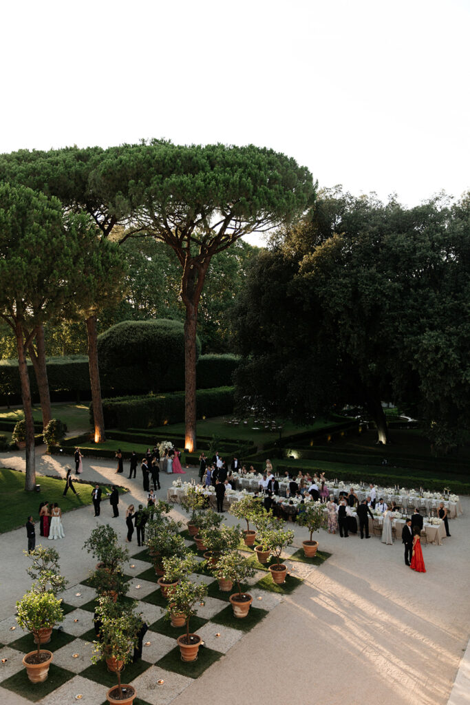 Bride Katya Ruiz in gown at elegant garden event.