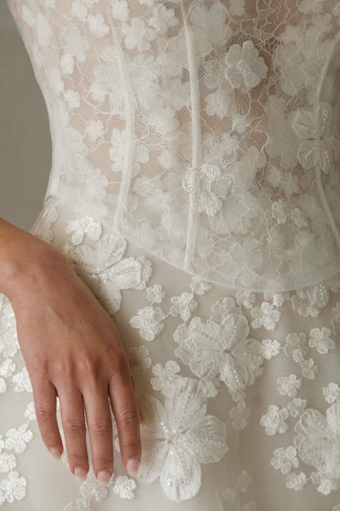 Hand on embroidered, sheer lace dress with 3D flowers.