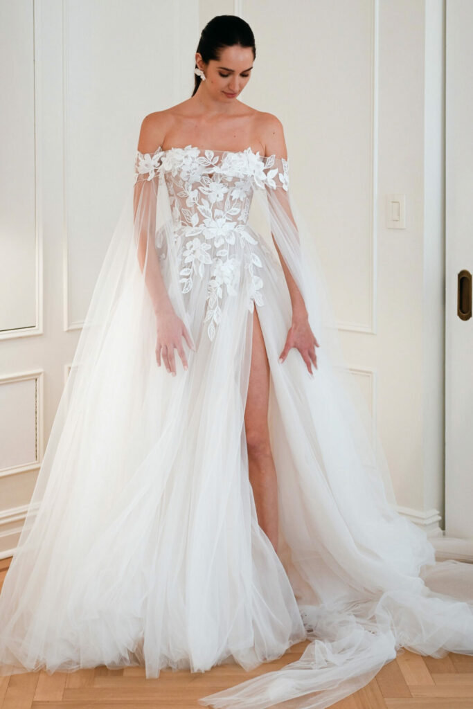 Bride in off-shoulder tulle gown with floral lace.
