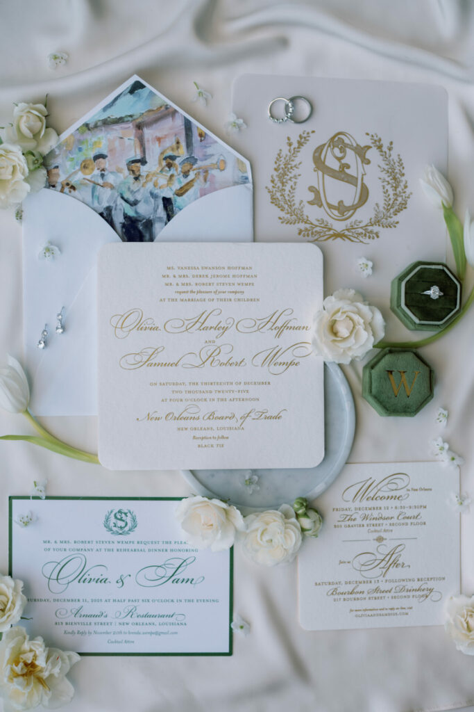 Elegant wedding invitations, white flowers, green ring box.