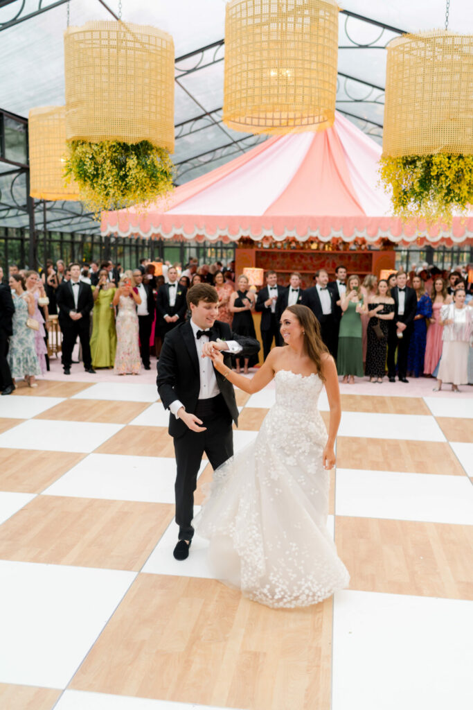 Katya Ruiz dances in couture gown under glowing lights.