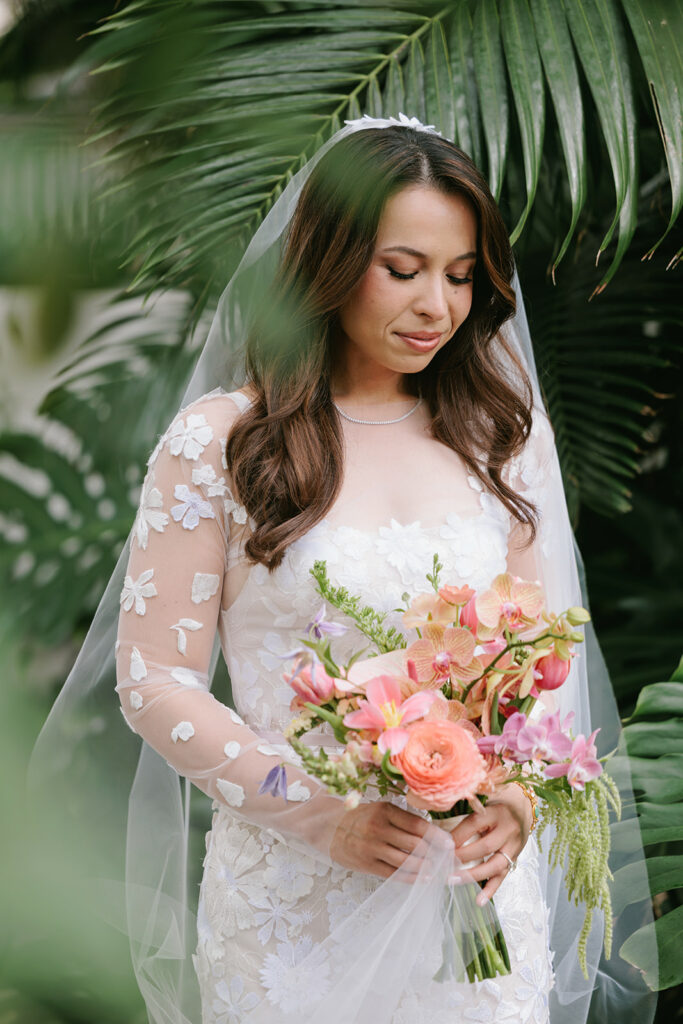 Taylor in the Ness floral gown by Mira Zwillinger, serene amid tropical leaves in Kapolei