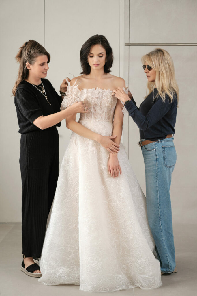 Bride’s floral Ness & Nessia dress adjusted by two.