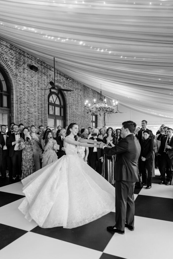 Katya Ruiz and groom’s first dance under glowing chandeliers.