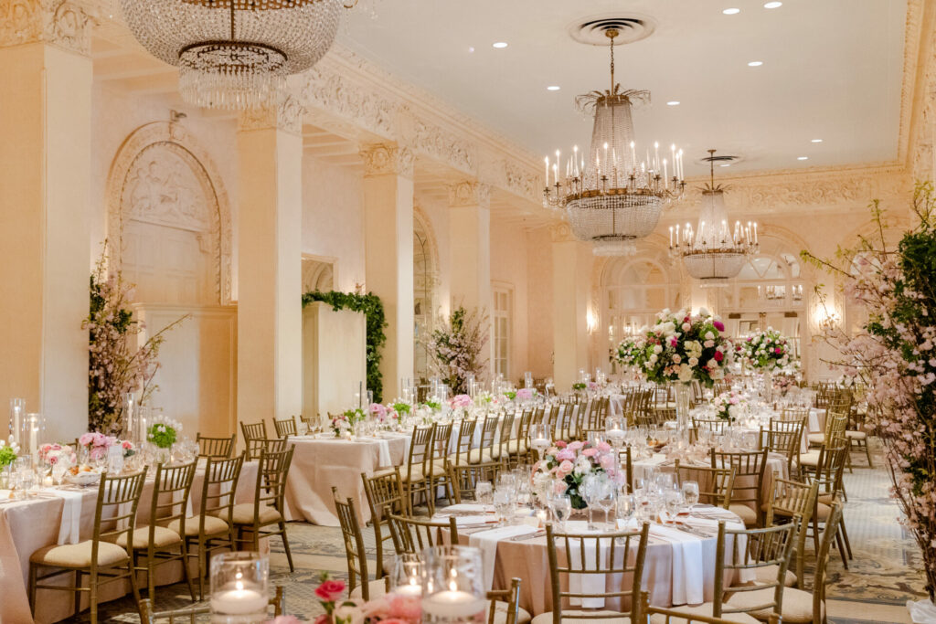 Katya Ruiz in gown at elegant wedding ballroom.