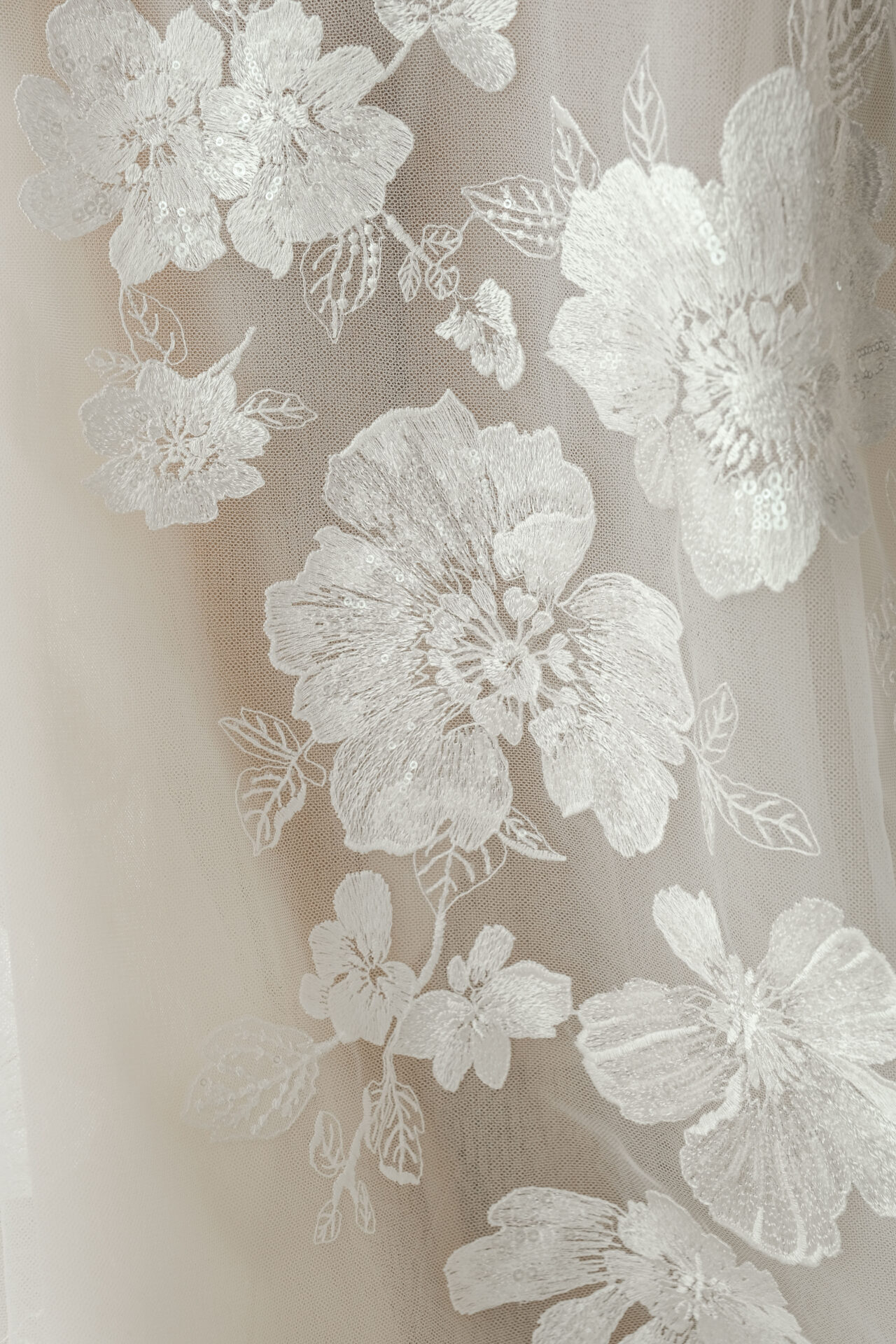 Sheer Ness & Nessia fabric with white floral embroidery.