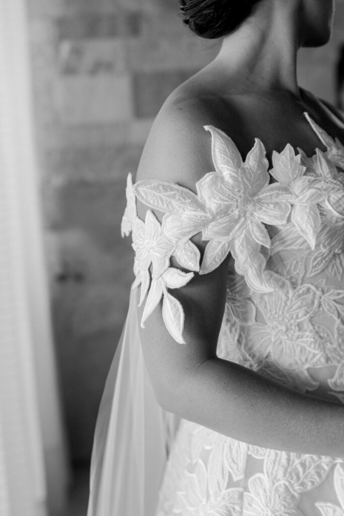 Katya Ruiz in lace couture gown, updo, black-and-white.