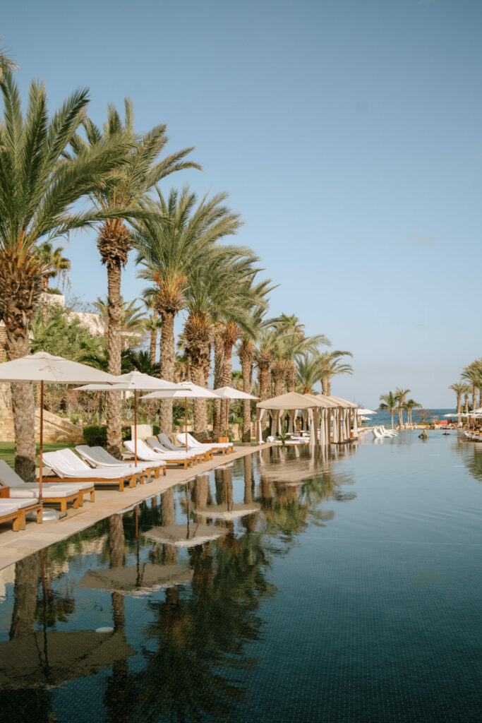 Poolside loungers, umbrellas, palm trees, sea view; perfect for Katya Ruiz's bridal moment.