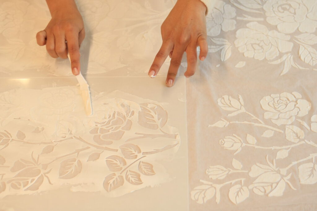 Mira Zwillinger atelier process — hand-printed florals on the Elka SS27 strapless wedding dress