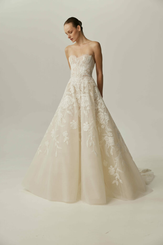 Person in modern Sui-style floral embroidered wedding gown.