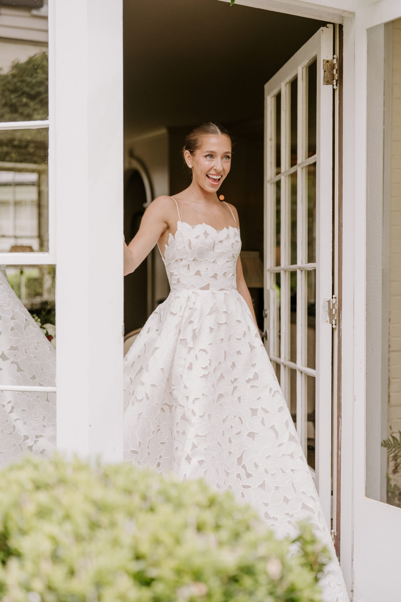 Rebecca in the Ayla wedding dress with floral-inspired cutouts by Mira Zwillinger