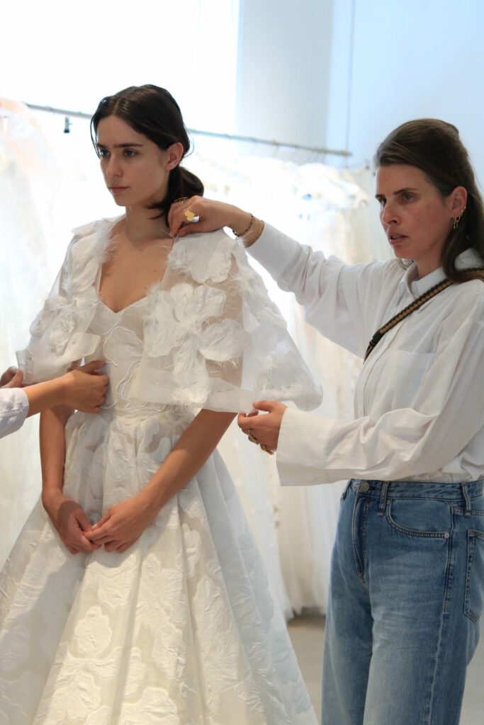 Woman in Clea wedding dress being fitted in studio.