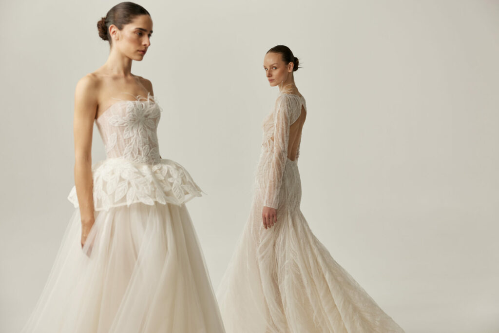Two women in off-white Ness & Nessia gowns, minimalist studio.