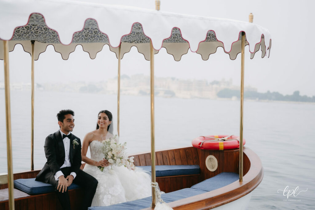 Katya Ruiz and groom smiling on elegant boat.